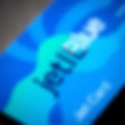 A close-up view of a JetBlue credit card featuring vibrant blue and green colors