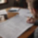 Reviewing Financial Documents A thoughtful individual reviewing financial documents
